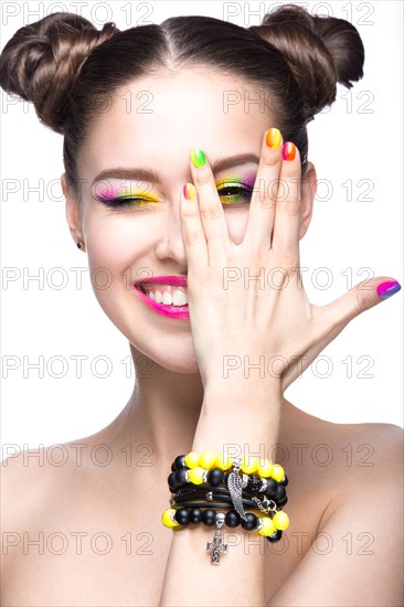 Beautiful girl in pink sunglasses with bright makeup and colorful nails. Beauty face. Picture taken in the studio on a white background
