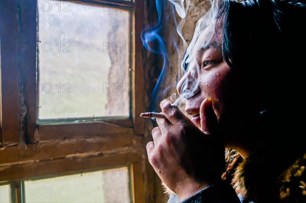 Monk smoking in a monastery