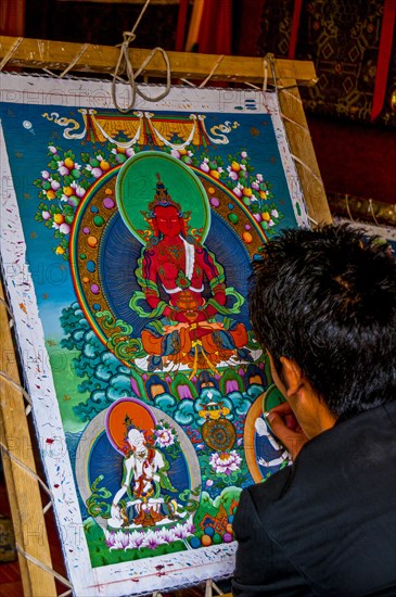 Painter drawing a Thanka