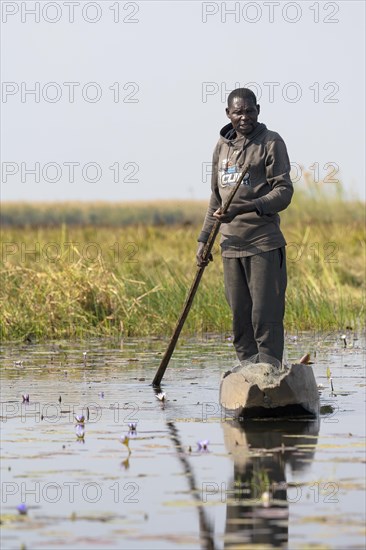 Fisherman in a dugout canoe