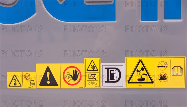 Warning signs on construction machinery