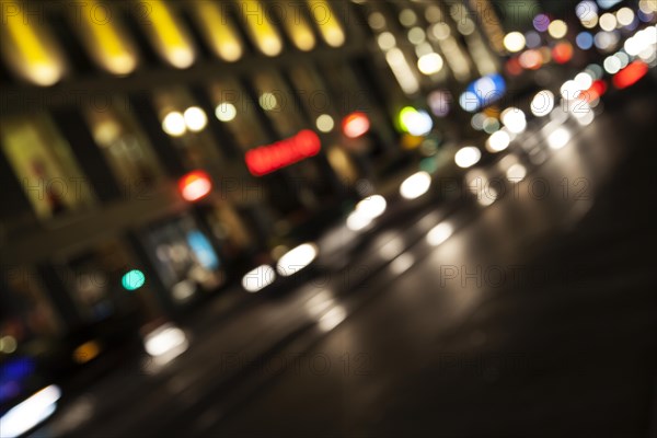 Blurred headlights in evening rush hour traffic