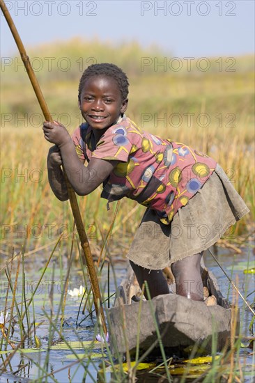 Smiling girl on canoe