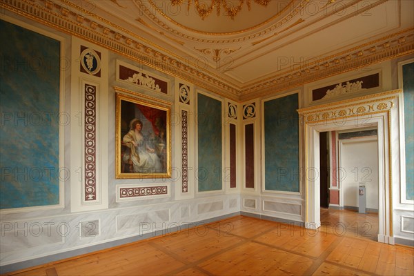 Interior view with paintings and ornaments in the room