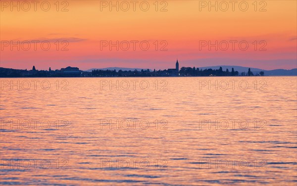 Church and harbour of Romanshorn in the evening light