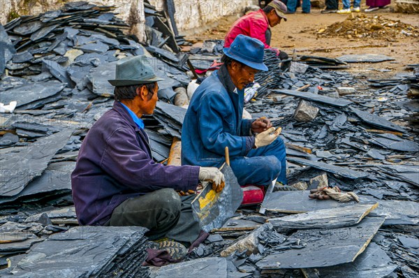 Men cracking stones