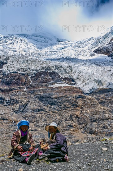 Pilgrims taking a break on the Karo-La Pass along the Friendship Highway