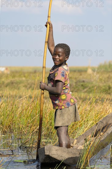 Smiling girl on canoe