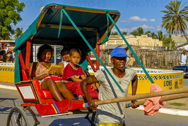 Man running with his walking rickshaw