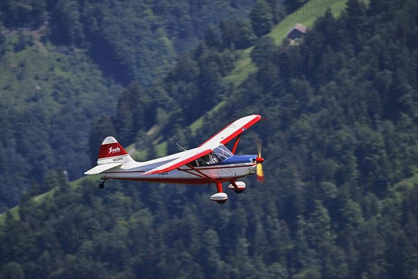 Vintage aircraft Stinson Voyager 108-2 in flight