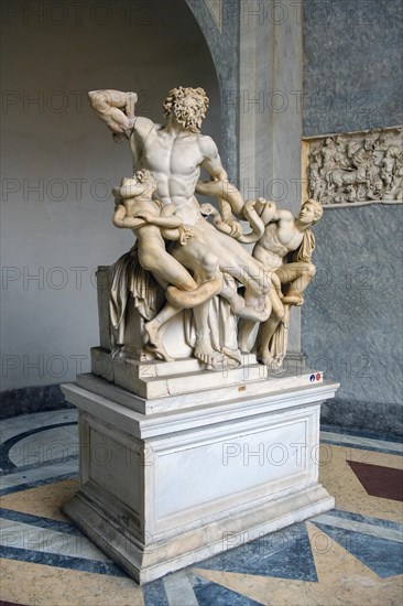 View from half left on historical sculpture in marble Marble sculpture by ancient sculptor Laocoon Group of priest Laocoon and sons fighting battle with snake