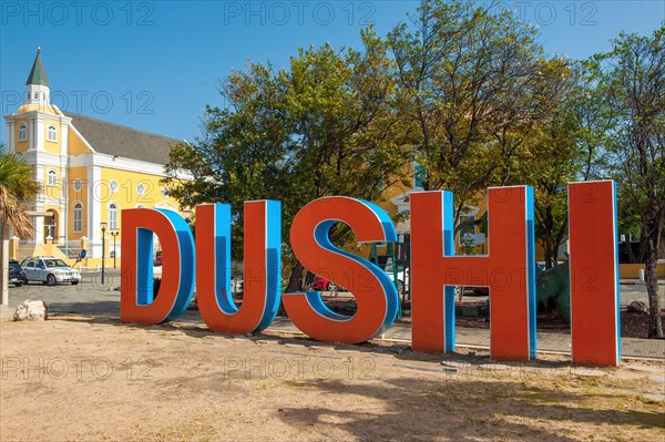 Lettering in the form of free-standing oversized capital letters of Creole language Papiamentu word Dushi term for pet name Schatzi