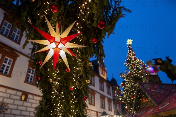 Christmas market lights in a town square as Advent begins. Coburg