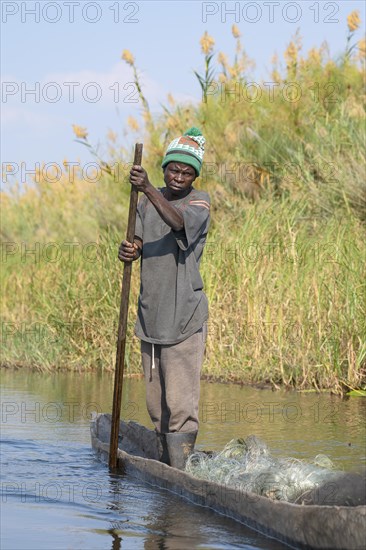 Fisherman on his canoe