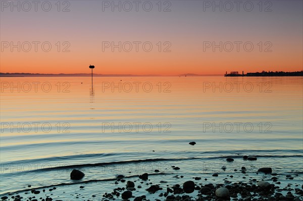 Sea mark at sunset on Lake Constance near Lochau