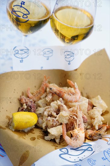 Still life with breaded seafood and wine