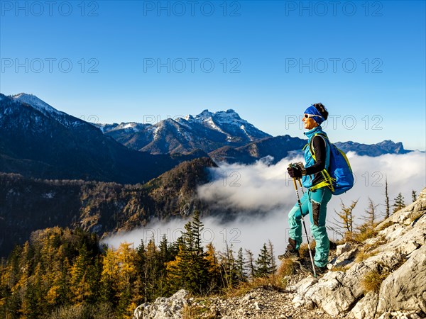 Mountaineer above timberline and clouds enjoying the sun