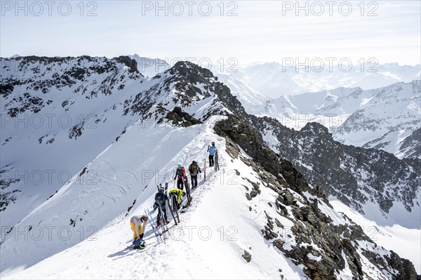 Mountaineers at the summit of the Sulzkogel