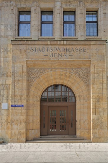 Building with portal and ornaments of the municipal savings bank and inscription