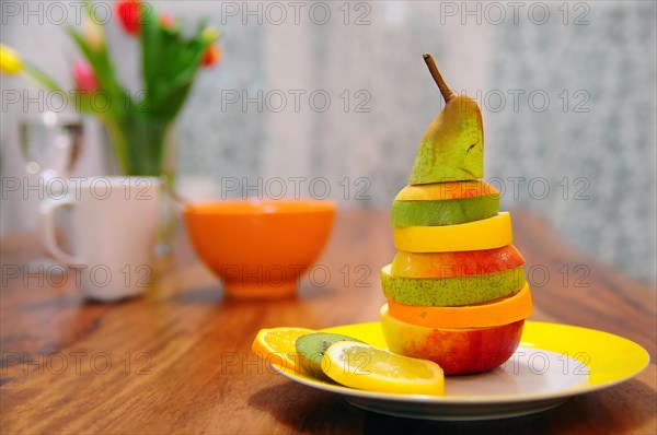 Slices of different fruits layered on top of each other