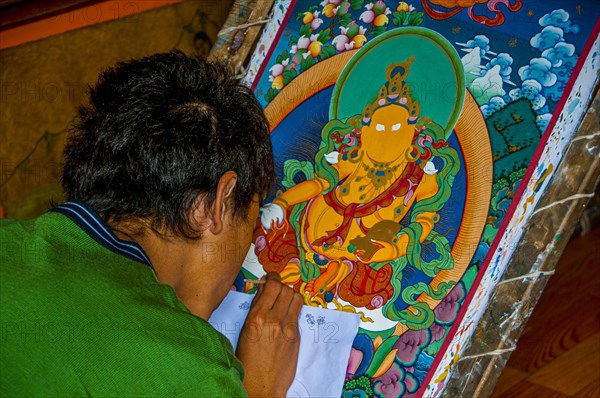 Painter drawing a Thanka