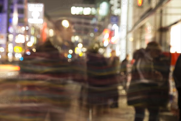 Blurred passers-by in the city centre