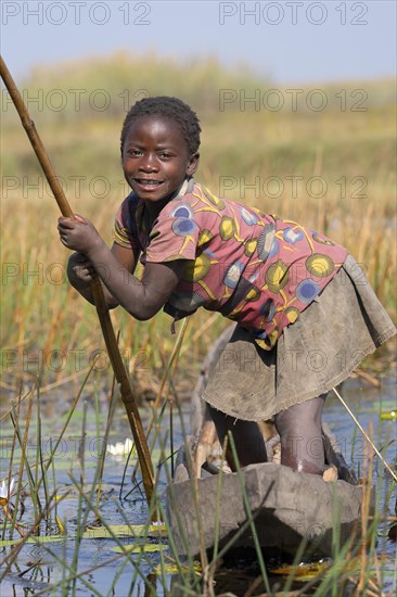 Smiling girl on canoe