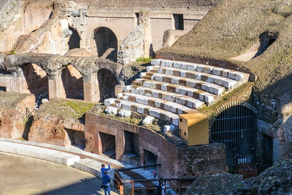 Restored historic grandstand seating marble seating tiers near east entrance of Colosseum