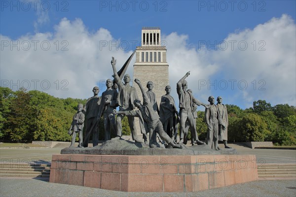 Group of figures by Fritz Cremer with bell tower