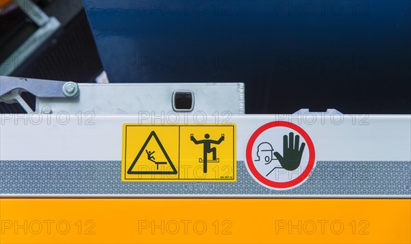 Warning signs on construction machinery