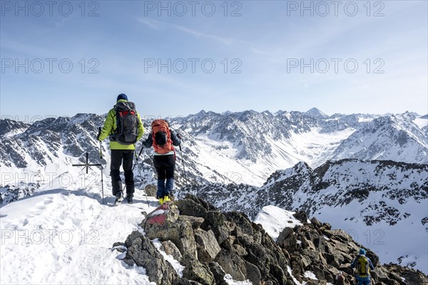 Mountaineers at the summit of the Sulzkogel