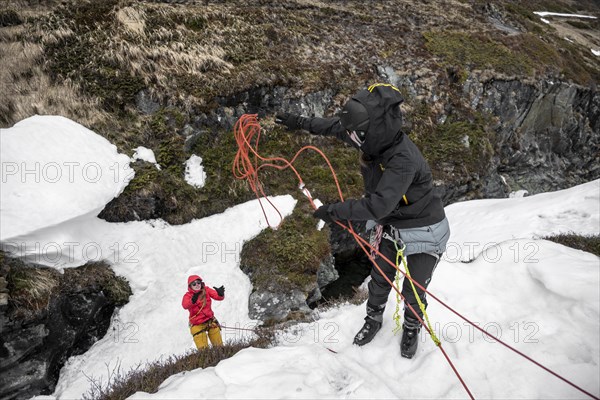 Exercise crevasse rescue for ski touring on a cliff