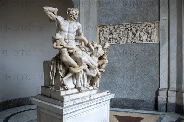 View from half left on historical sculpture in marble Marble sculpture by ancient sculptor Laocoon Group of priest Laocoon and sons fighting battle with snake