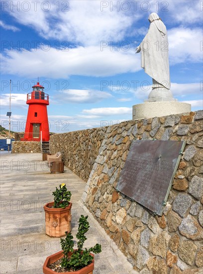 Memorial Monument with memorial plaque on the right for victims of sinking of cruise ship Ship sinking disaster Ship disaster Costa Concordia