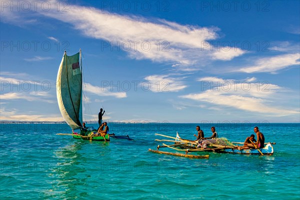 Traditional sailing boat and rowing boat with a dead