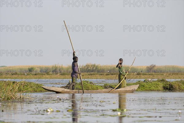 Local children in canoe