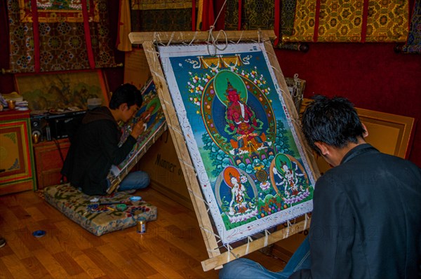 Painter drawing a Thanka