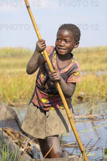 Smiling girl on canoe