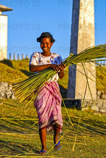 Friendly young woman with red in her hands