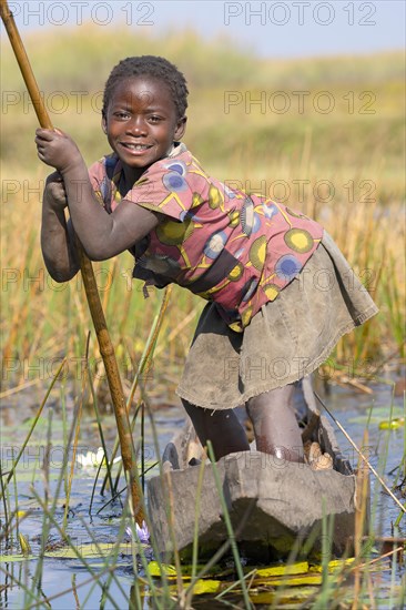 Smiling girl on canoe