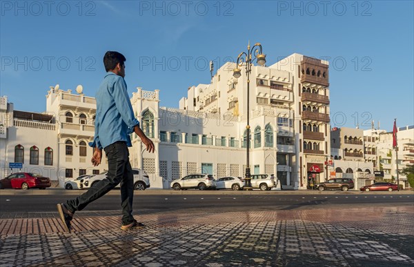 Man walks on sidewalk