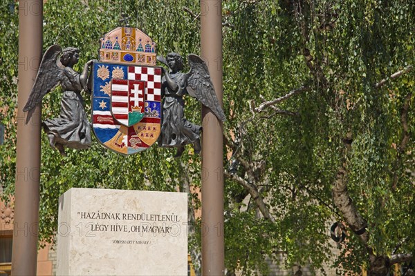 Coat of arms with two angels and quotation hazadnak rendueletlenuel legy hive magyar by poet Mihaly Voeroesmarty