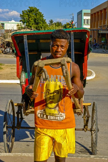 Man running with his walking rickshaw