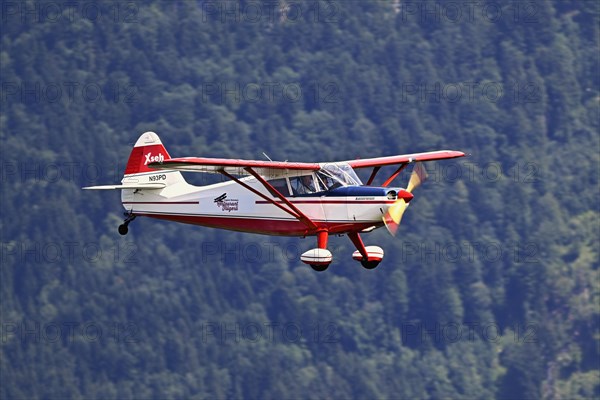 Vintage aircraft Stinson Voyager 108-2 in flight