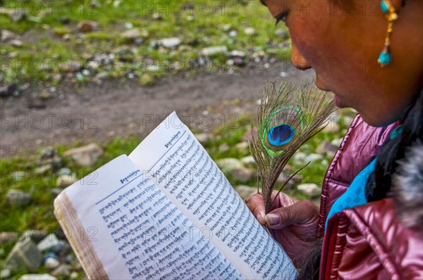 Student writing with a peasant feather