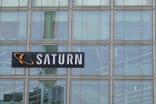 Glass facade with Saturn logo