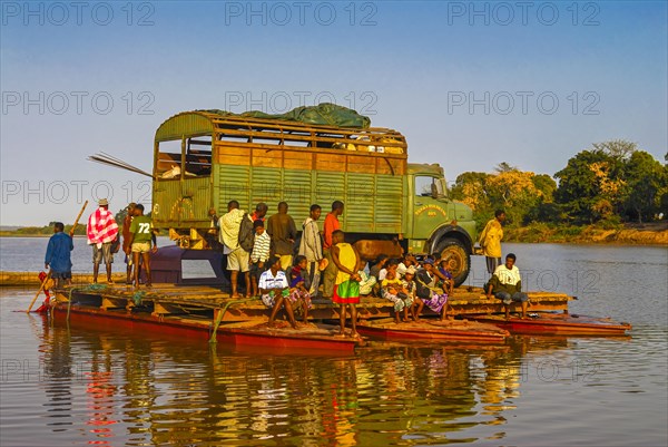 Truck crossing on a improvised ferry the Manambolo river