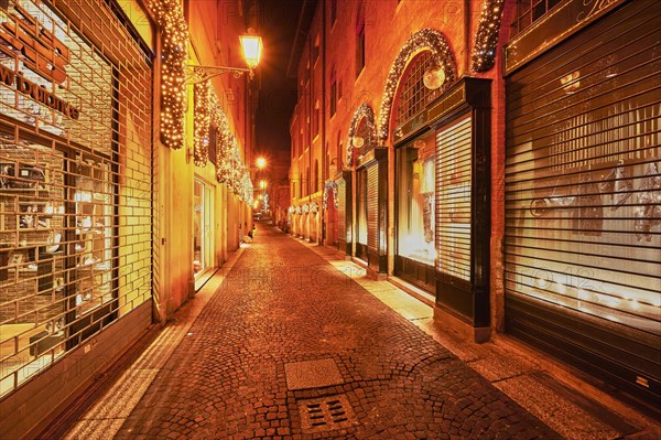 Shop window in the pedestrian zone with Christmas lights