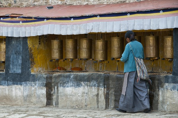 Old tibetan pilgrim in the Drepung temple