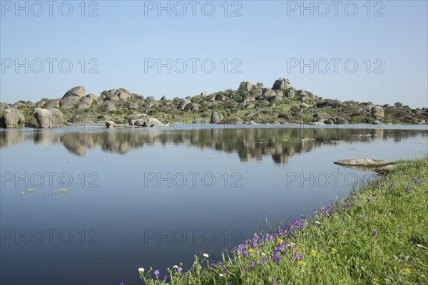 Landscape with lake and rock formations